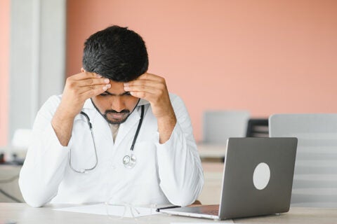 A doctor having a head ache