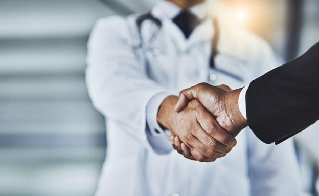 Doctor shaking hand with patient