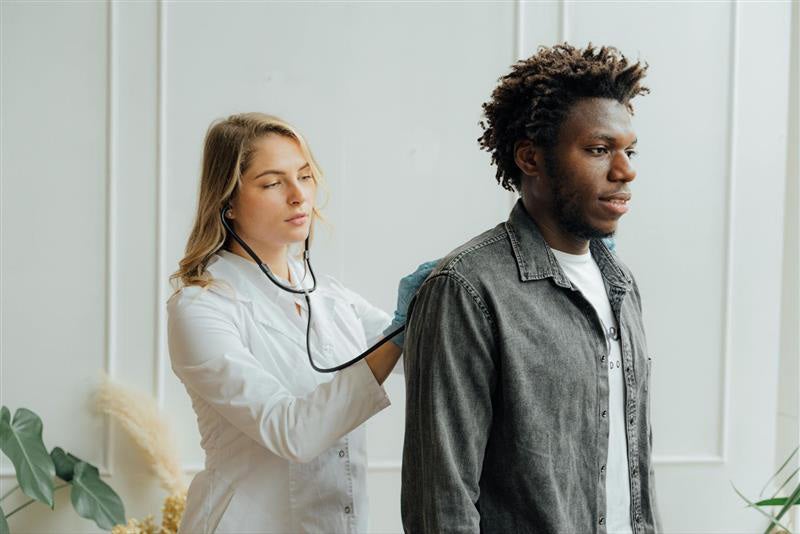 doctor checking patient