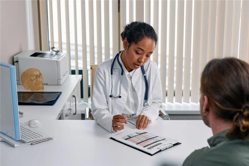 Doctor checking patients reports